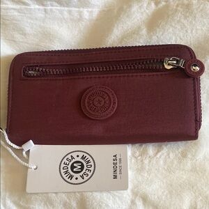 Elegant Red Wallet with Textured Finish and Secure Zipper